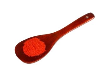 paprika on wooden spoon