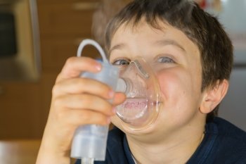 child taking respiratory, inhalation therapy