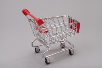 Empty Shopping Cart On Gray Background
