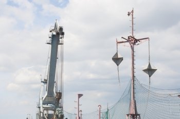 Targets for warship, with crane in background.