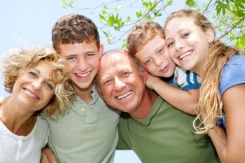 portrait of happy smiling family looking at camera
