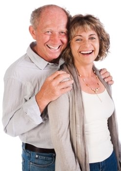 Senior couple posing in studio and smailing at camera.