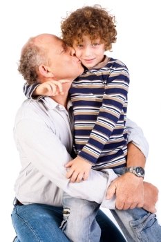 Grandson kissing his grandfather isolated on white background.