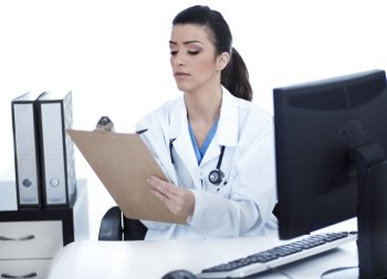 Doctor woman sitting on her office making notes on white background
