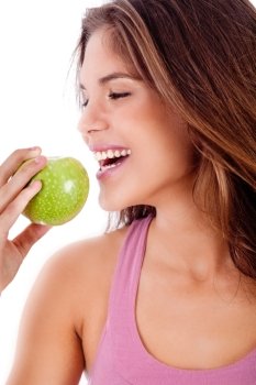 Closeup of happy young girl ready to bite a green apple