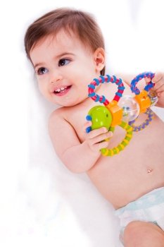 Baby playing with toys in a white isolated background