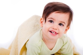 Infant crawling with towel and smiling with tounge out in a white background