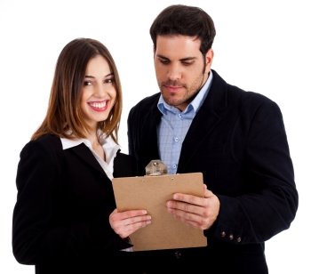 Front view of male and female colleagues holding notepad and discussing against white isolated background