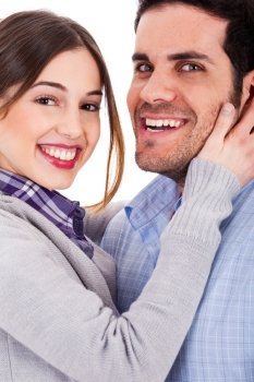 Young couple  hugging each other and smiling on a isolated white background