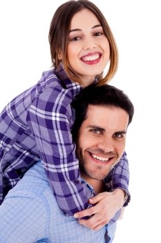 Portrait of young man giving piggyride to her girlfriend against isolated white background