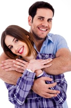 Closeup portrait of a cute young man hugging his wife from behind