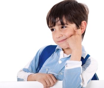 Portrait of a adorable school boy thinking on white isolated background