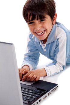 Cute smiling caucasian kid with laptop on isolated white background