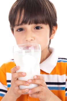 Happy kid drinking glass of milk on isoalted background