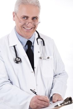 Smiling medical doctor writing prescription on white background