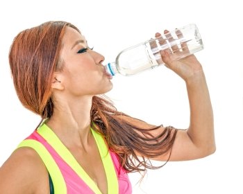 Beautiful Chinese woman with water bottle after exercise