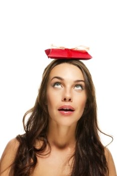 beautiful woman with a red present on her head. beautiful woman with a red present on her head on white background