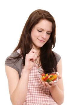 smiling woman with a salad. smiling beautiful woman eating mixed salad on white background