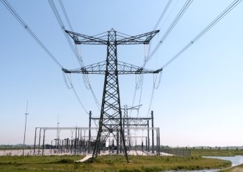Electricity pylon with pwer lines and blue sky