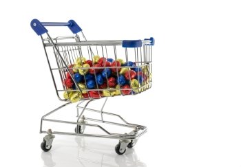 shopping cart with easter eggs isolated on white