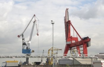big industry cranes in rotterdam harbor