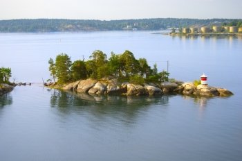 Small island with lighthouse, Sweden
