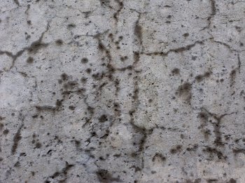 Close up of cracked concrete wall surface