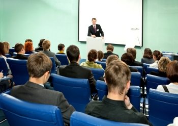 Successful Businessman Talking to Audience at the Business Conference