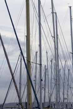 Looking through masts and rigging of yachts.
