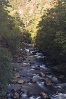 River Glaslyn running through alpine style valley. Beddgelert, Snowdonia, Gwynedd, Wales, United Kingdom’ Long exposure.