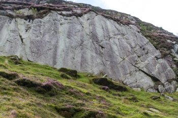 Rock smoothed by ice age glacier passing over it. Drws-y-coed Valley, Snowdonia National Park, Gwynedd, Wales, United Kingdom.