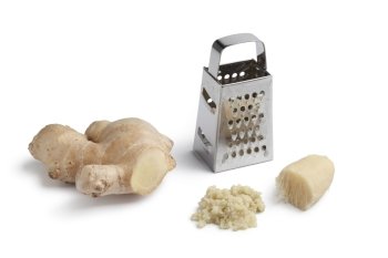 Fresh and grated ginger root on white background