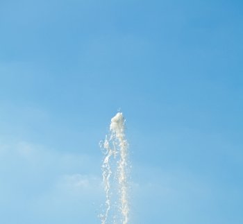 jet of water against the blue sky