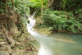 waterfall in thai national park in the deep forest on mountain. 