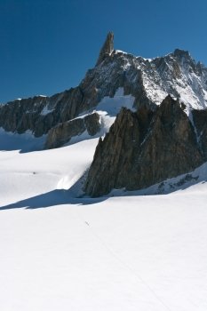 summer view of Dent du Geant peak and glacier in Mont Blanc massif