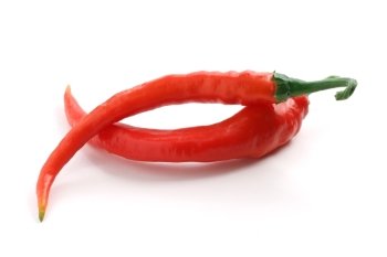 two hot chili peppers over white background