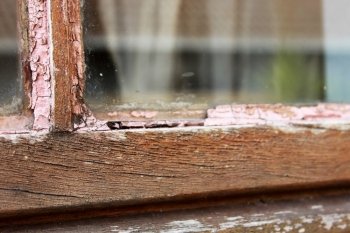 Dried Out Wooden Window Frame Requiring Maintenance 