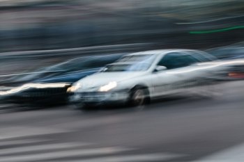 Cars in a Blurred City Scene