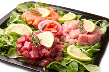 salmon, tuna and swordfish tartare with fresh salad