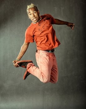 photo of dancer who is jumping high performing his movement
