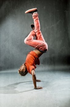 photo of break dancer who is performing his move 
