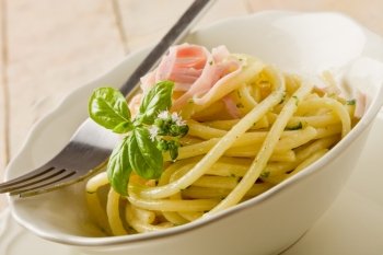 photo of delicious pasta with sour cream and ham