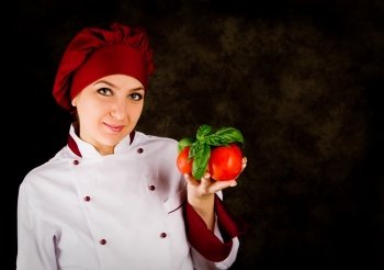 portrait photo of young female chef in front of rural background