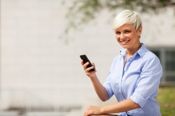 Photo of blonde businesswoman with mobilephone