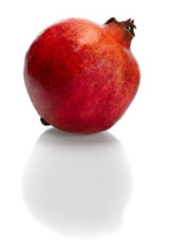 Red bright pomegranate on white background, isolated.