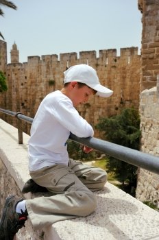 The boy on the wall in Jerusalem’s Old City, near the tower of David.
