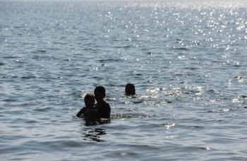 Swimming in the warm water of lake Kinneret 