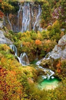 Waterfalls in a beautiful picturesque autumn scenery of the Plitvice Lakes National Park in Croatia