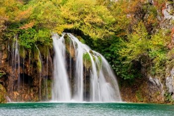 Scenic waterfall in a picturesque autumn scenery of the Plitvice Lakes National Park in Croatia