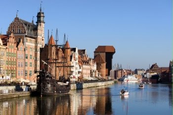 Picturesque scenery in the Old Town of Gdansk (Danzig) in Poland with Motlava river and the Crane on the far end